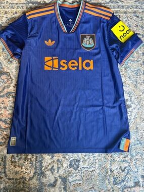 adidas blue and orange Newcastle United Sela Logo Jersey